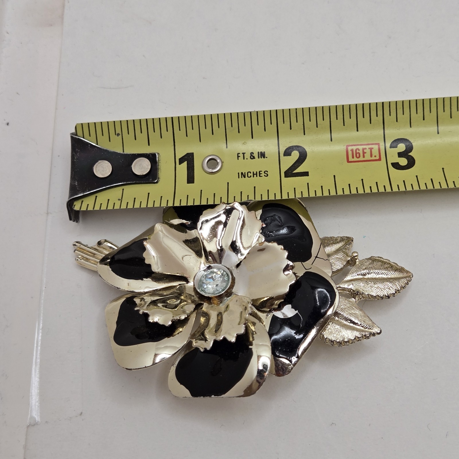 Black & Gold Tone Brooch/Pin With Moissanite Center Stone. Preowned Very Good
