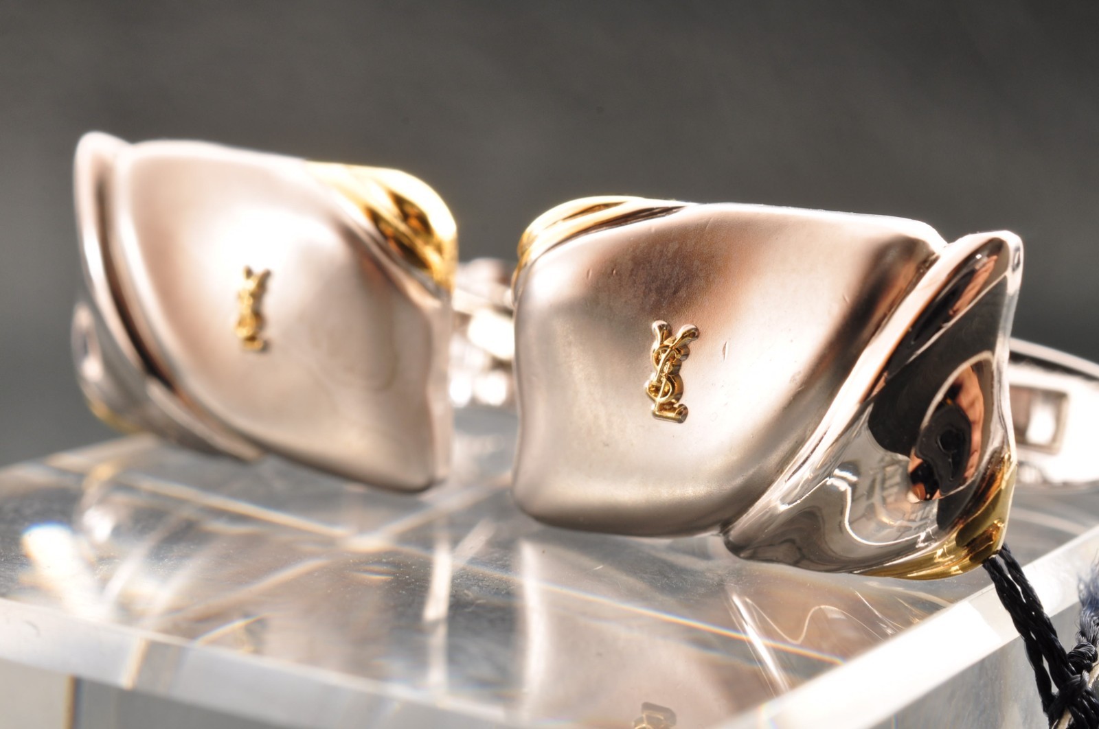 Near mint, gold and Cufflinks and silver tie clip, “Yves Saint Laurent”, case.