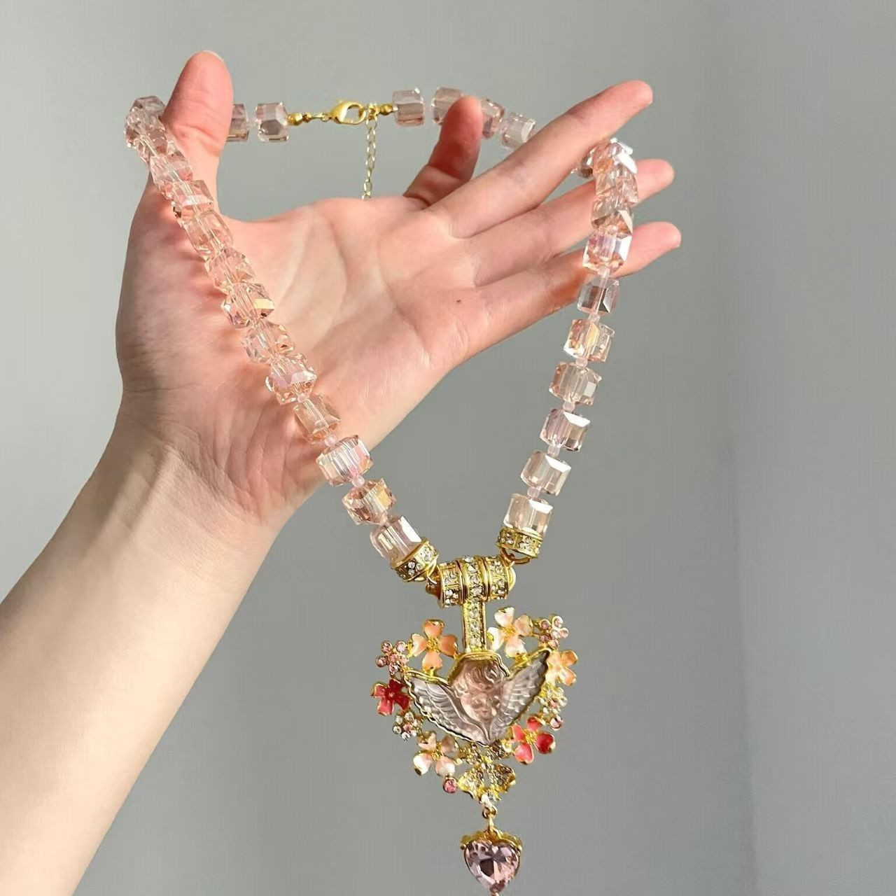 Pink beaded vintage sleeping angel pendant necklace