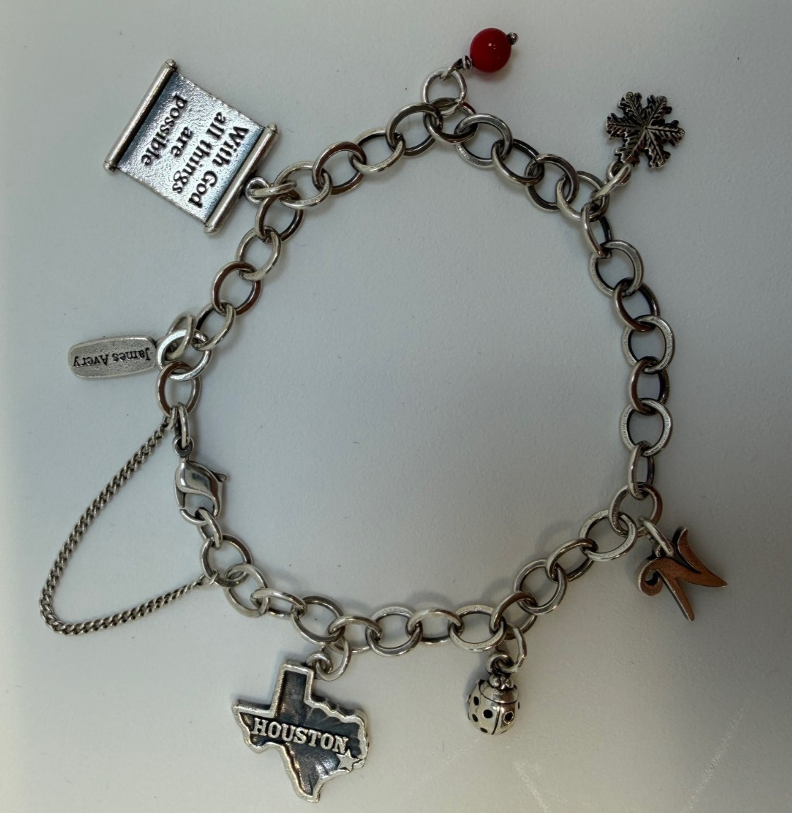 James Avery Sterling silver Charm bracelet with 6 Charms 7.5 Inch. 18+ Grams.