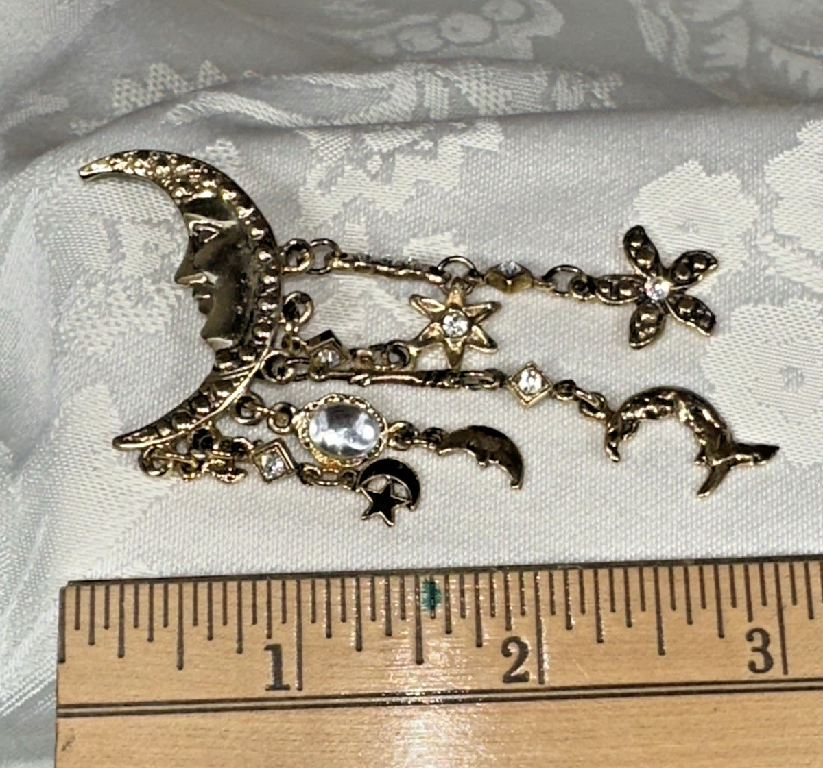 Gold Tone Crescent Moon With Dangling Stars, Cupid, Moon, Rhinestones Brooch