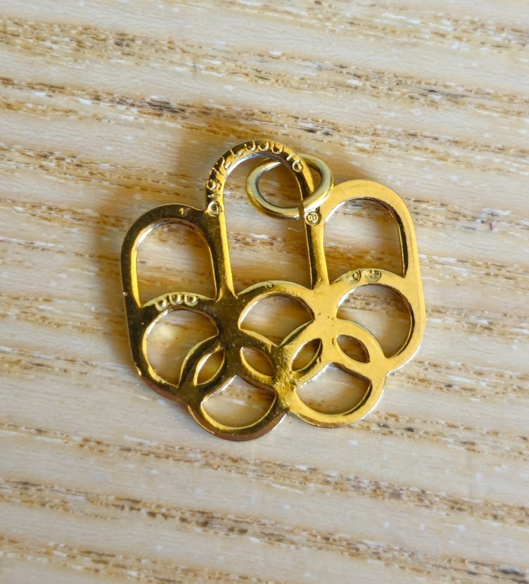 VINTAGE 1976 MONTREAL OLYMPICS GOLD TONE CHARM PENDANT MARKED 1972