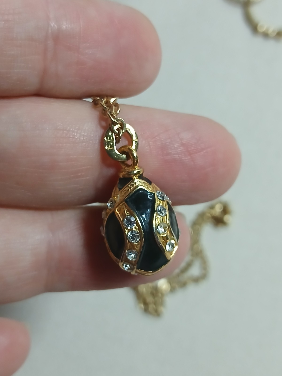 Vintage Edgar Berebi Rhinestone Enamel Gold Tone Egg Pendant Necklace