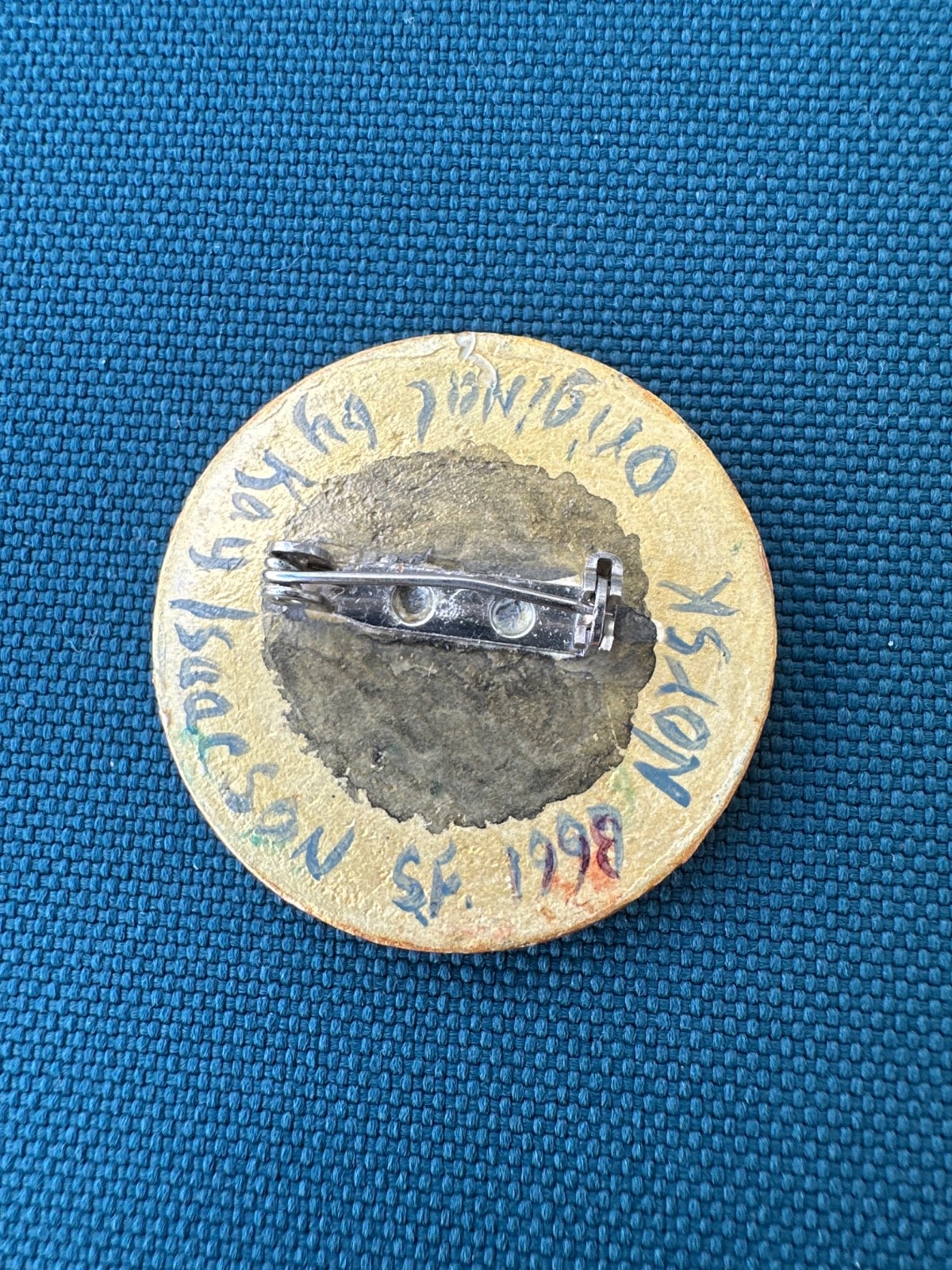 wooden brooch with traditional Norwegian rosemaling