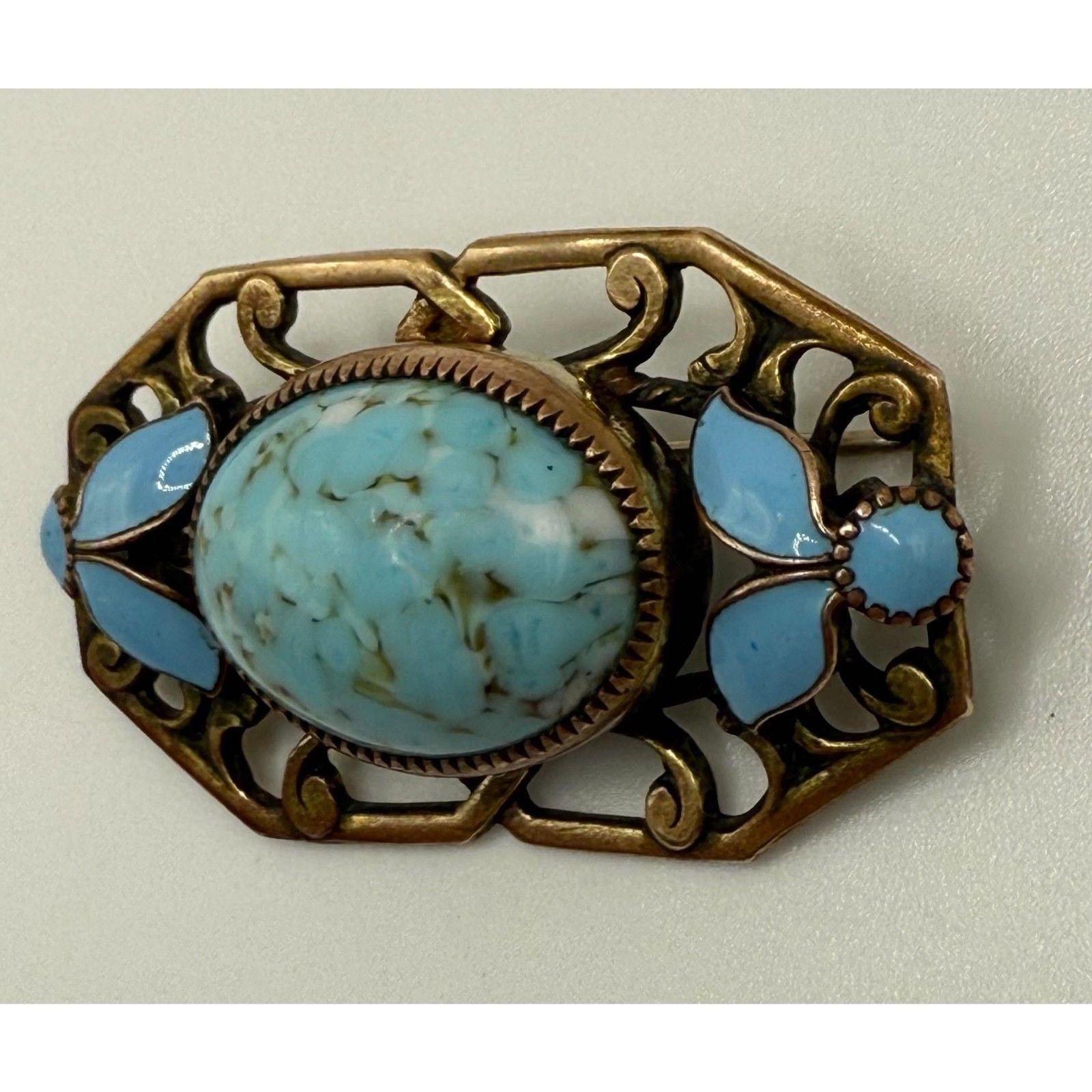 Turquoise brass brooch vintage source unknown