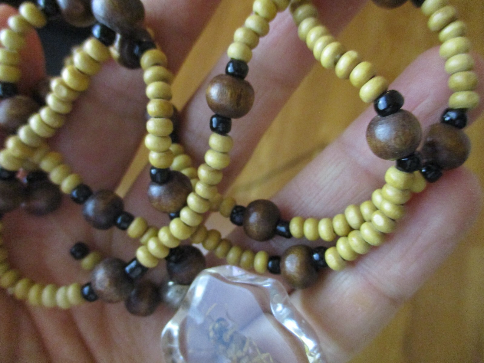 Necklace with bee coated plastic insect acrylic wood bead