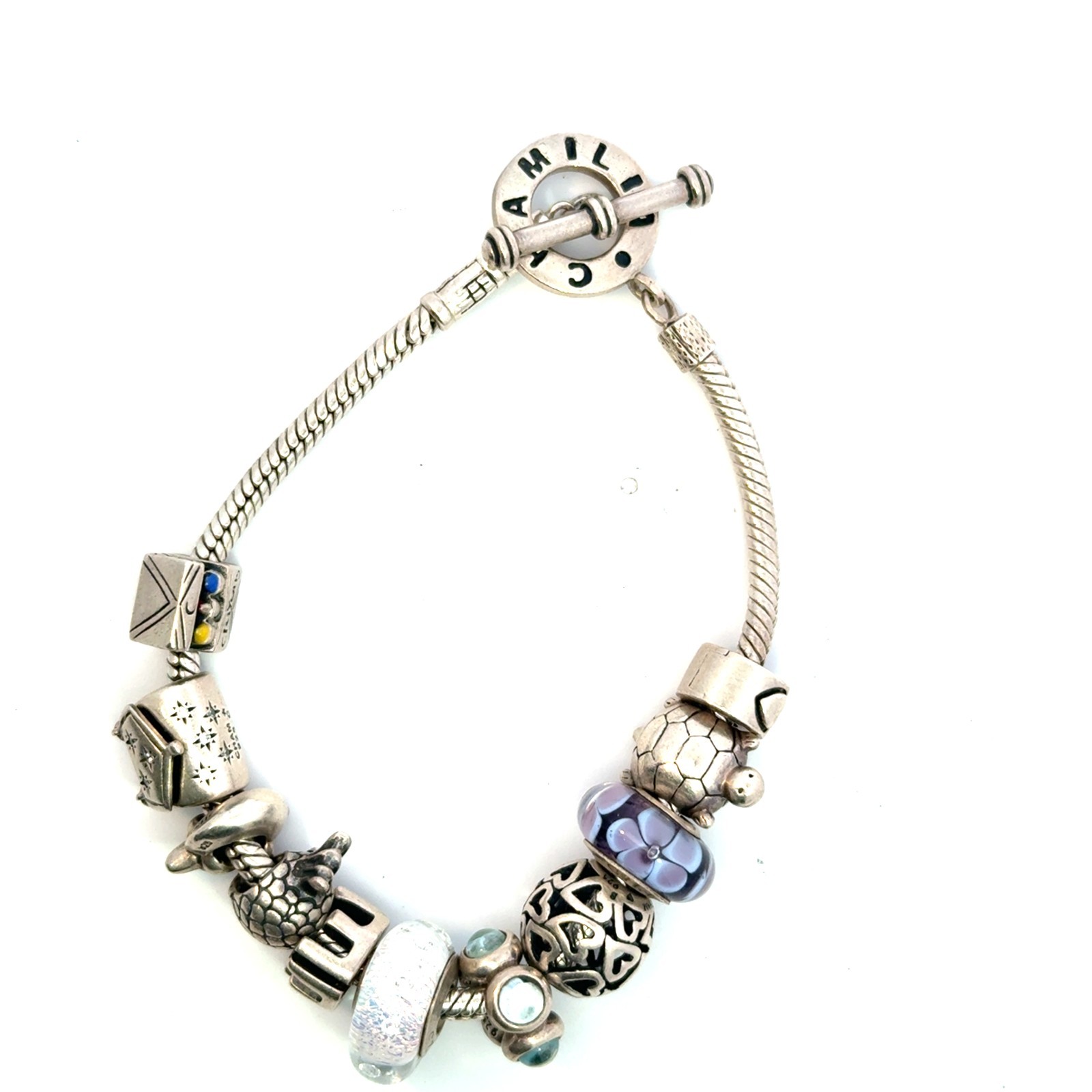 Authentic sterling silver chamilia 7.5in bracelet with 11 charms