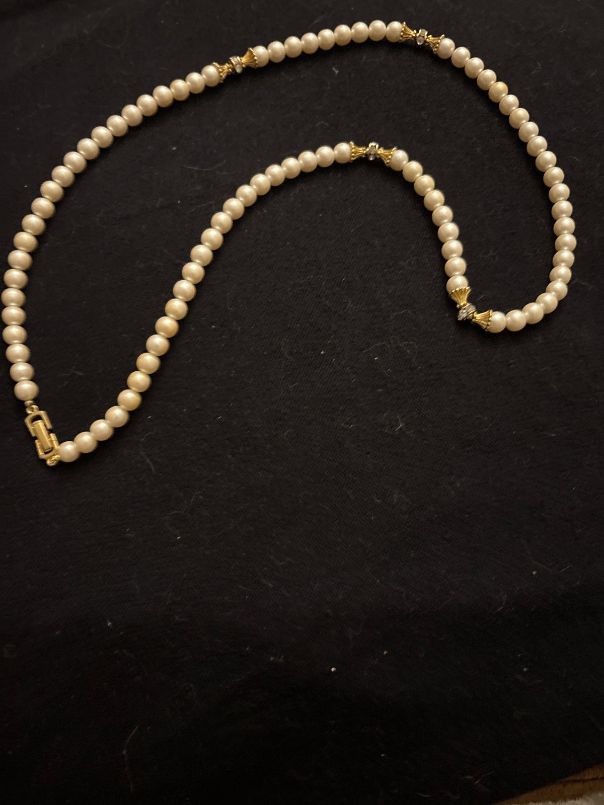 Vintage faux pearl necklace. Locking clasp. 20in. Gold-tone w/ rhinestones