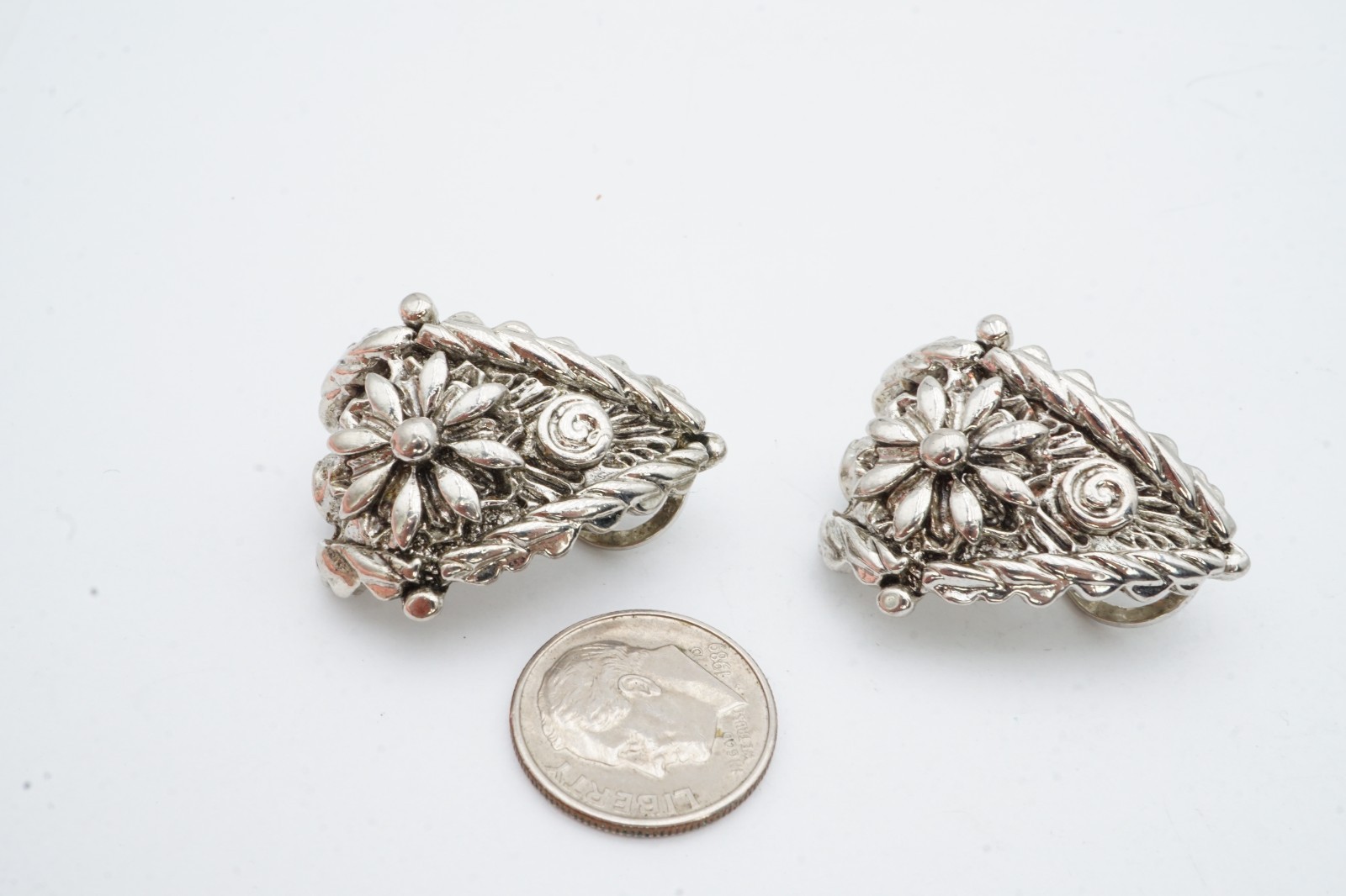 Vintage Clip On Earrings Silver Tone Textured Flower