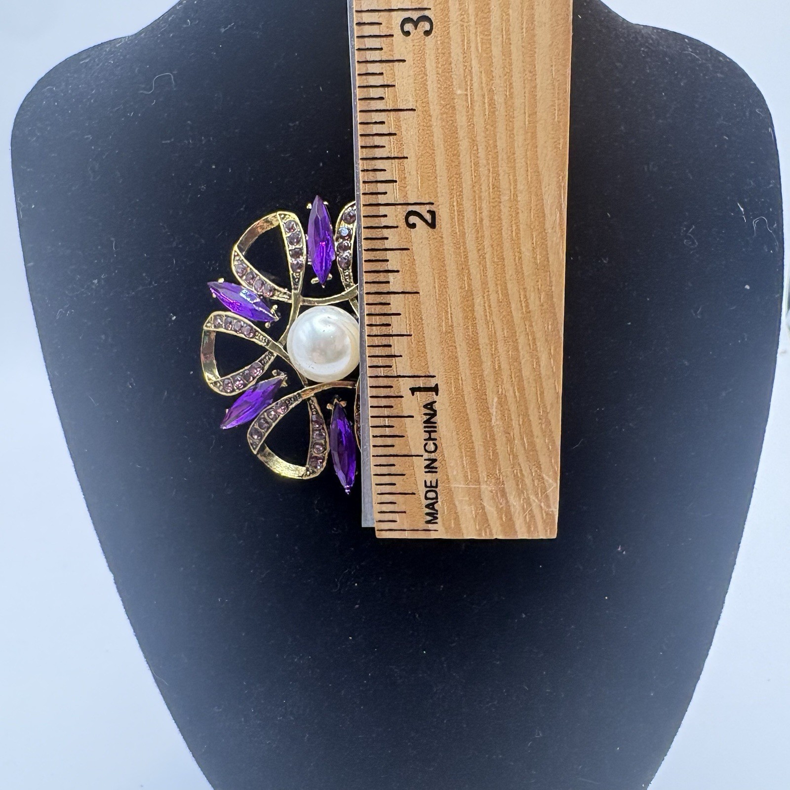 Beautiful Gold Tone 2 Inch Brooch with Purple Zircons and a Faux Pearl