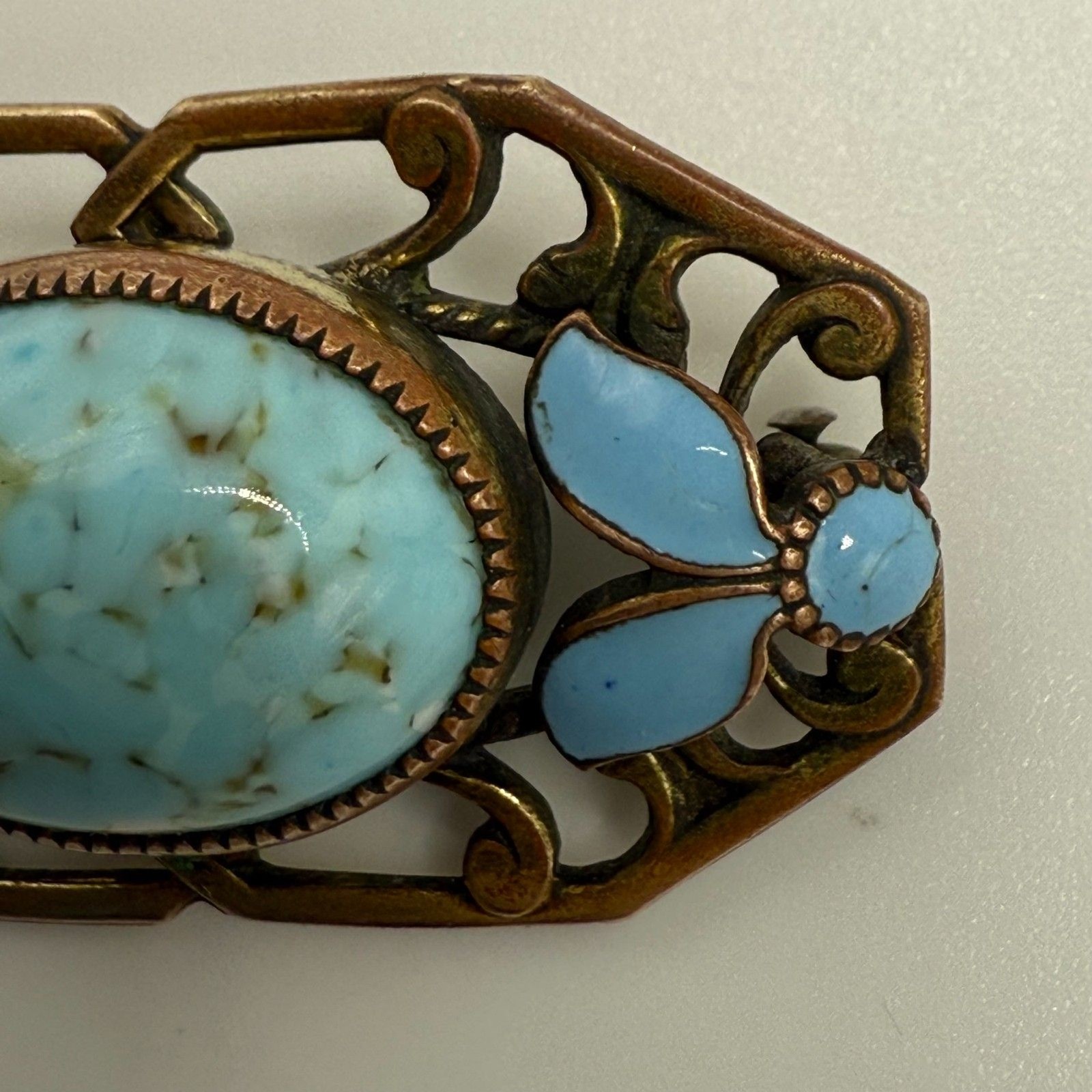 Turquoise brass brooch vintage source unknown