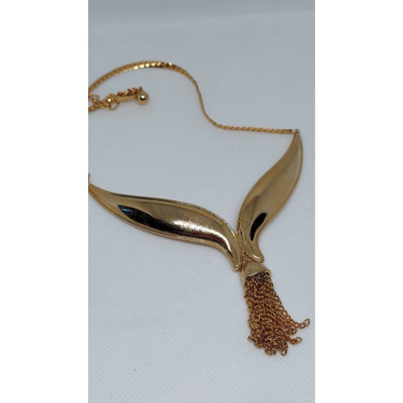 Vintage Avon tassel necklace V whale tail gold tone