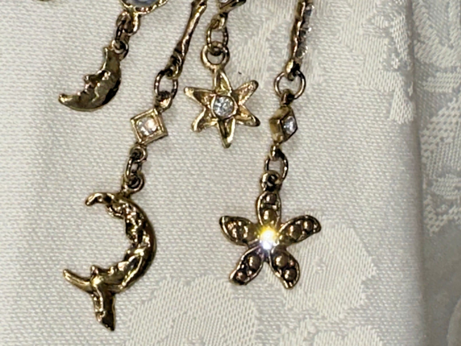 Gold Tone Crescent Moon With Dangling Stars, Cupid, Moon, Rhinestones Brooch