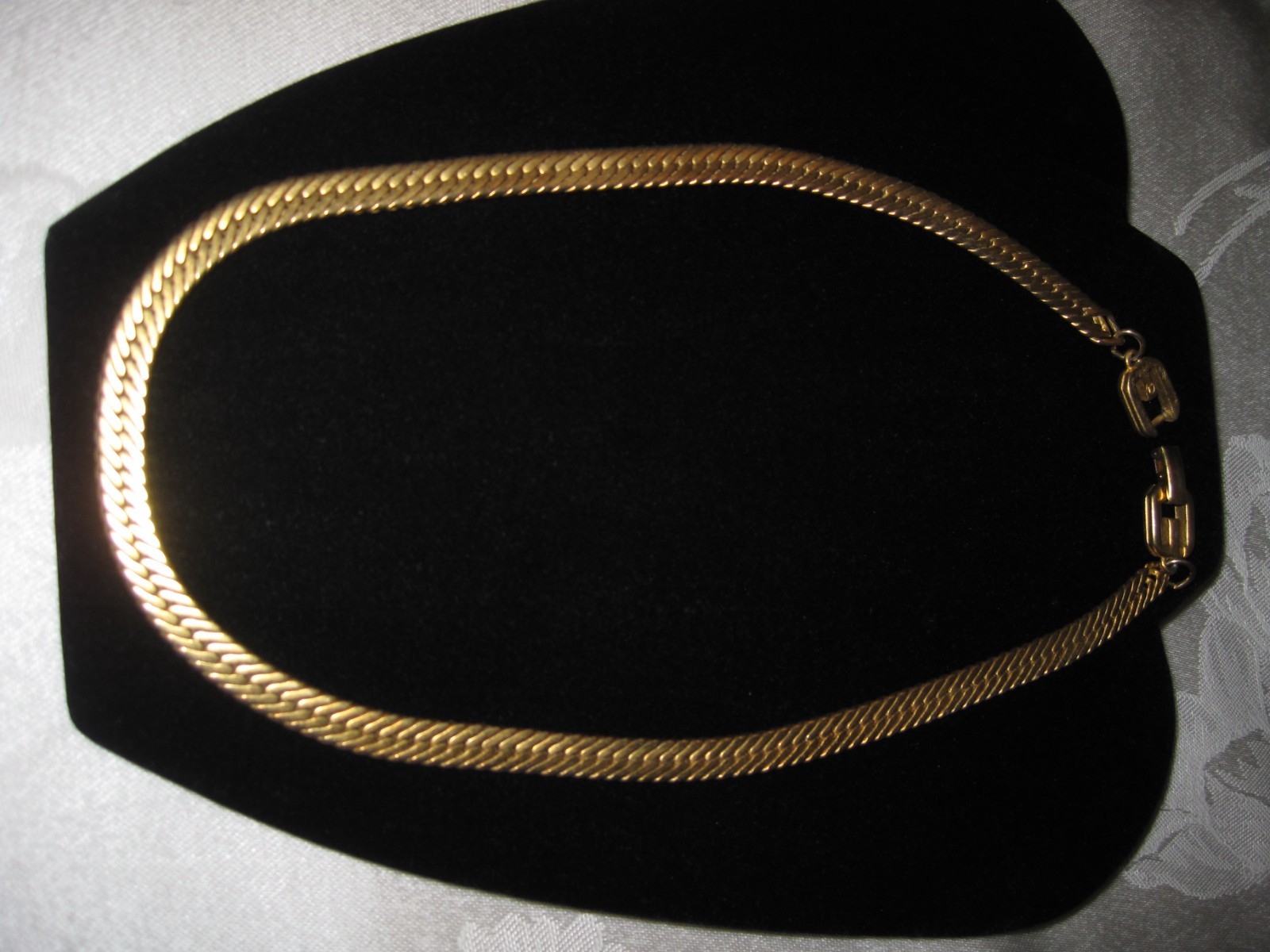 signed Givenchy gold tone herringbone flat style chain w/ double G clasp