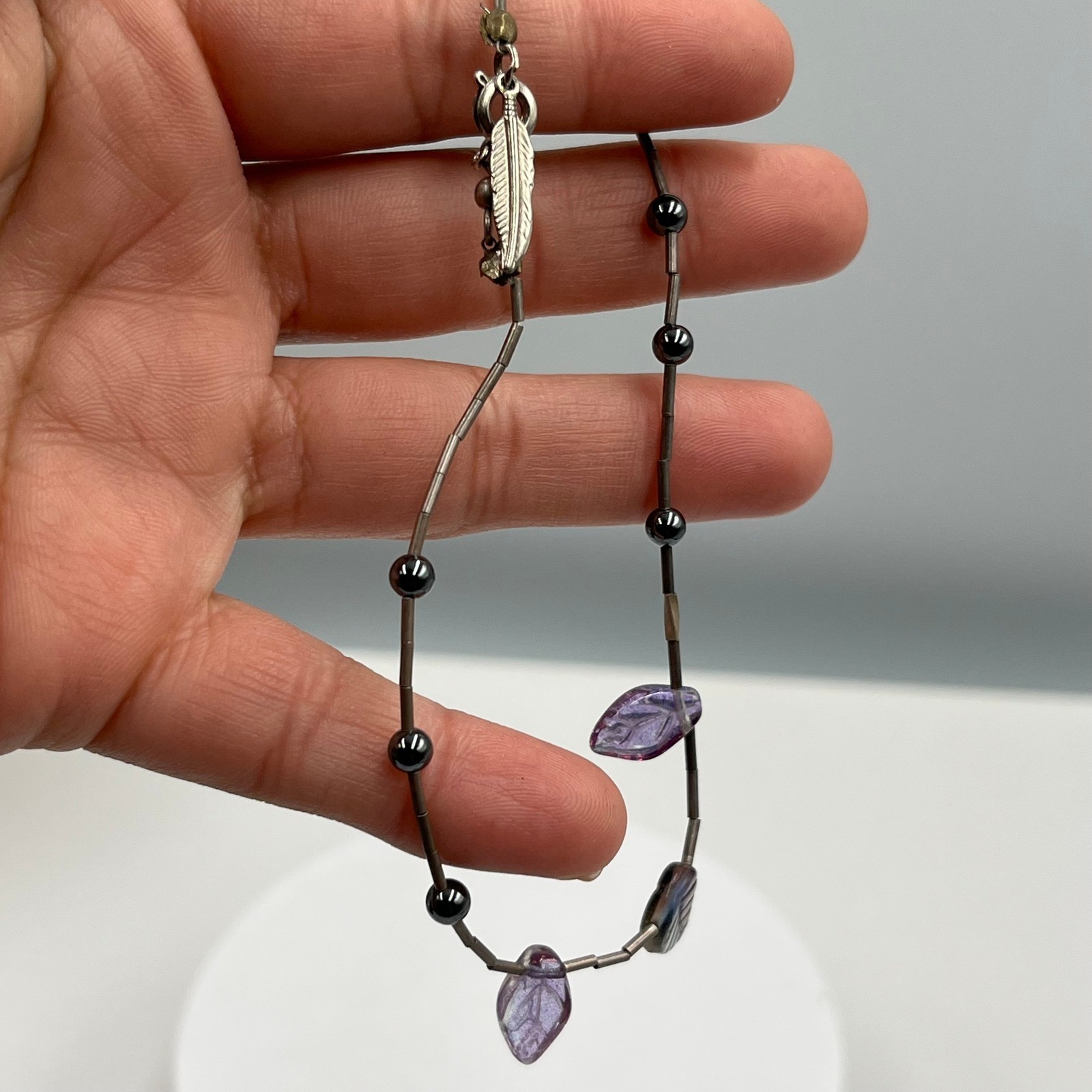 Vintage Liquid Silver Bead Bracelet Hematite Purple Glass Leaves Feather Charm