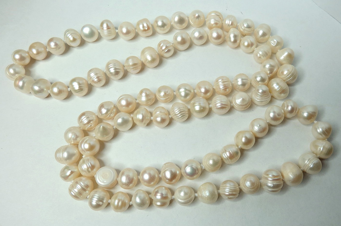 OVER 80 PIECES OF FRESHWATER WHITE PEARL 10MM, NECKLACE 32″ LONG