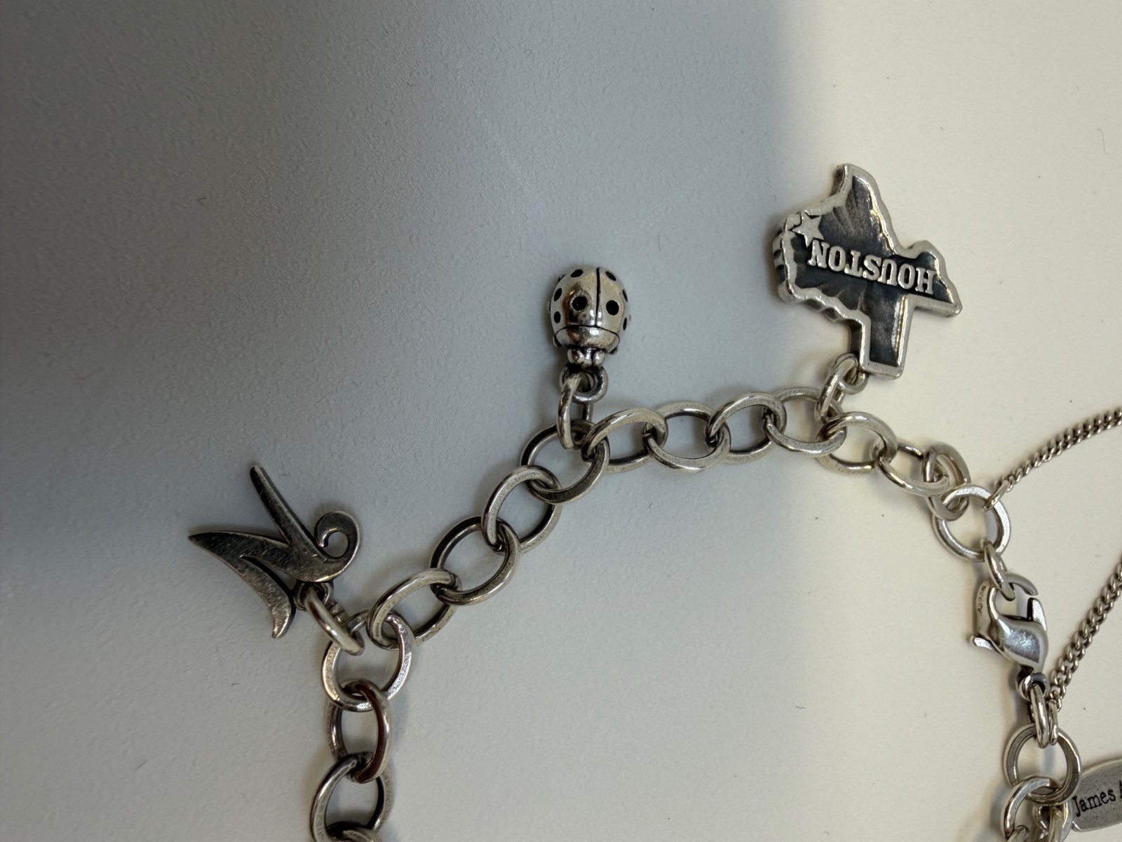 James Avery Sterling silver Charm bracelet with 6 Charms 7.5 Inch. 18+ Grams.
