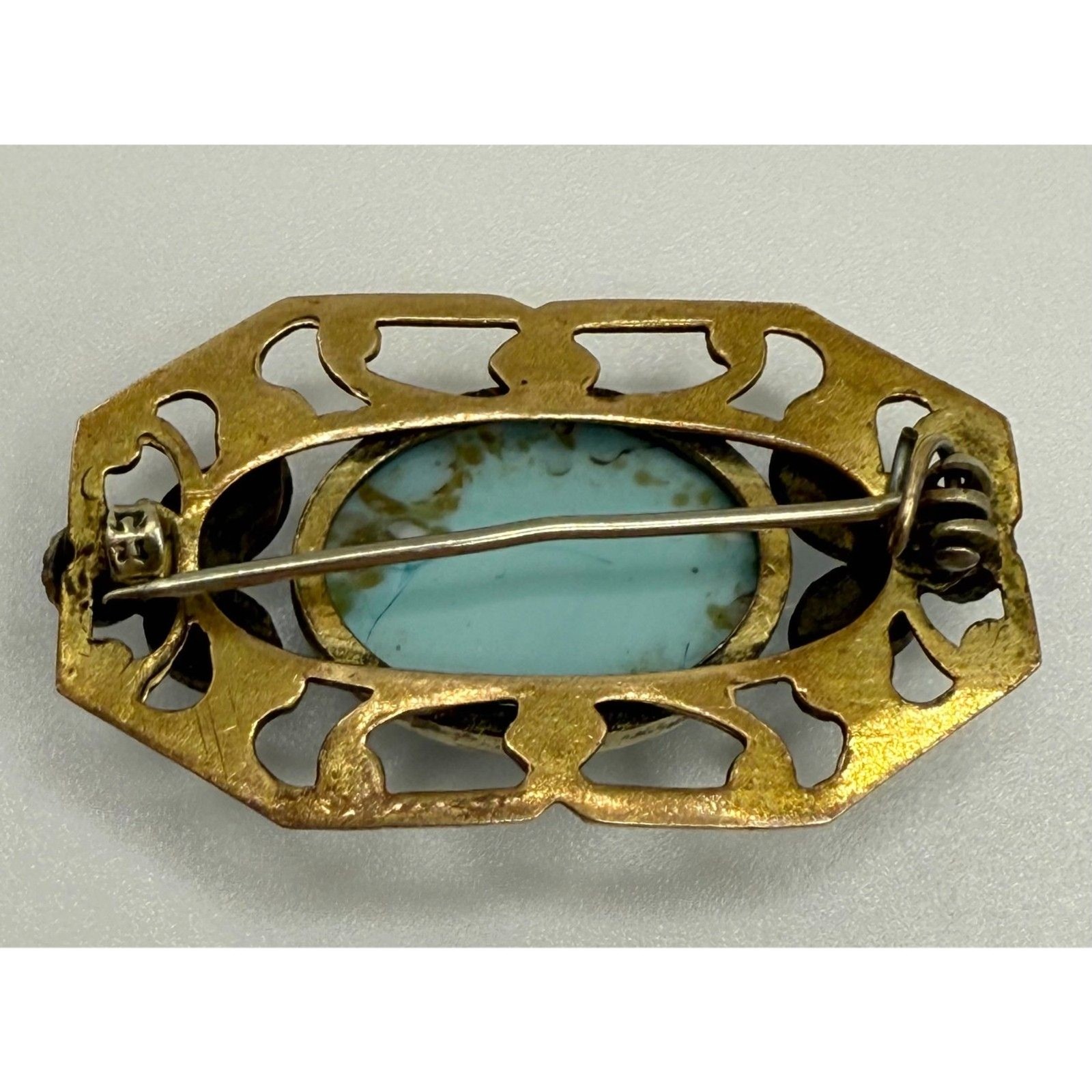 Turquoise brass brooch vintage source unknown
