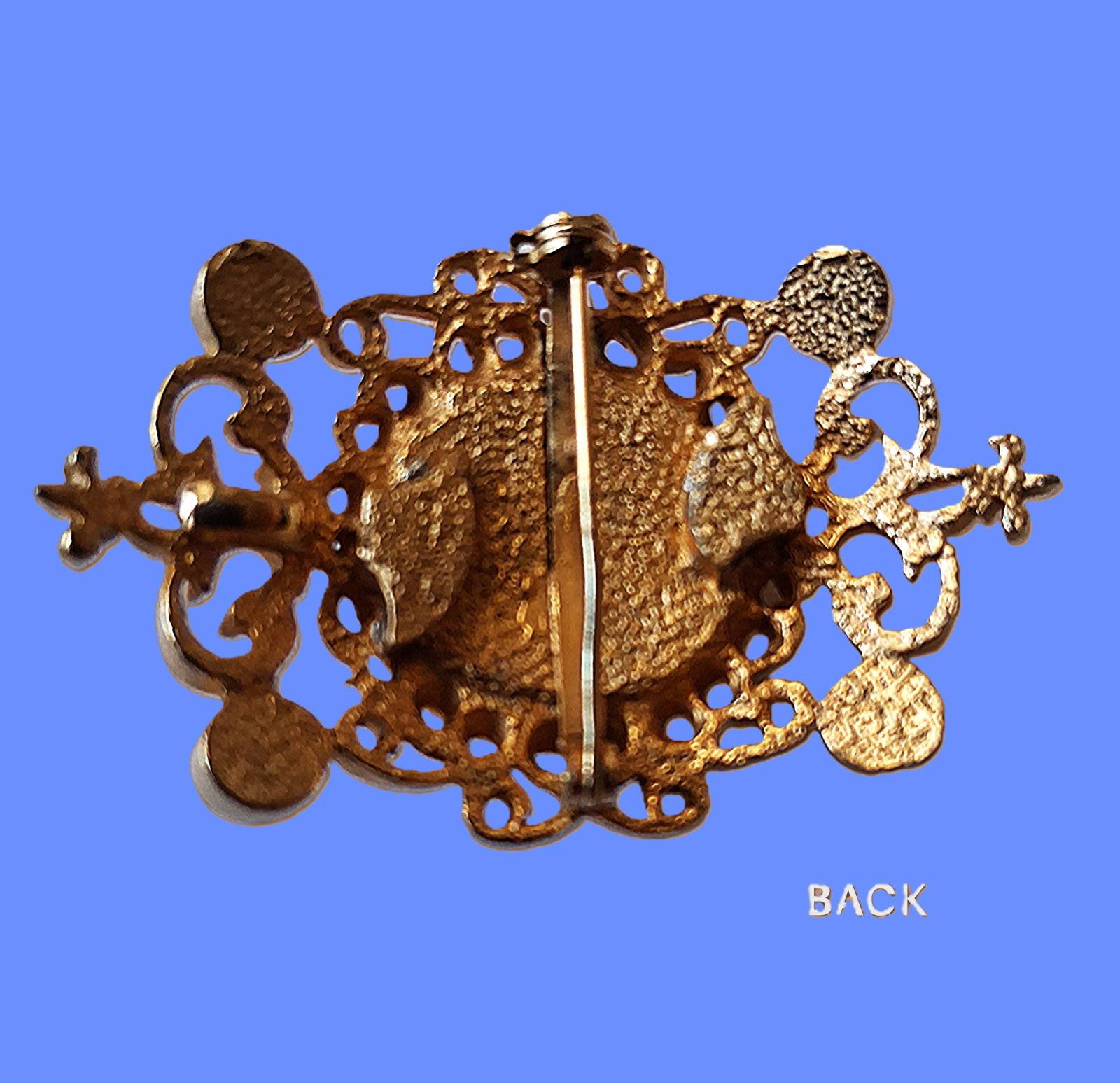 Vintage Filigree Brooch with a rich dark gray domed mirror-finished center stone
