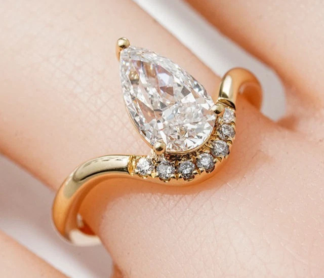 Pear & Round Cut 1.36TCW White Moissanite Wave Pattern Ring In 10K Yellow GoldFN