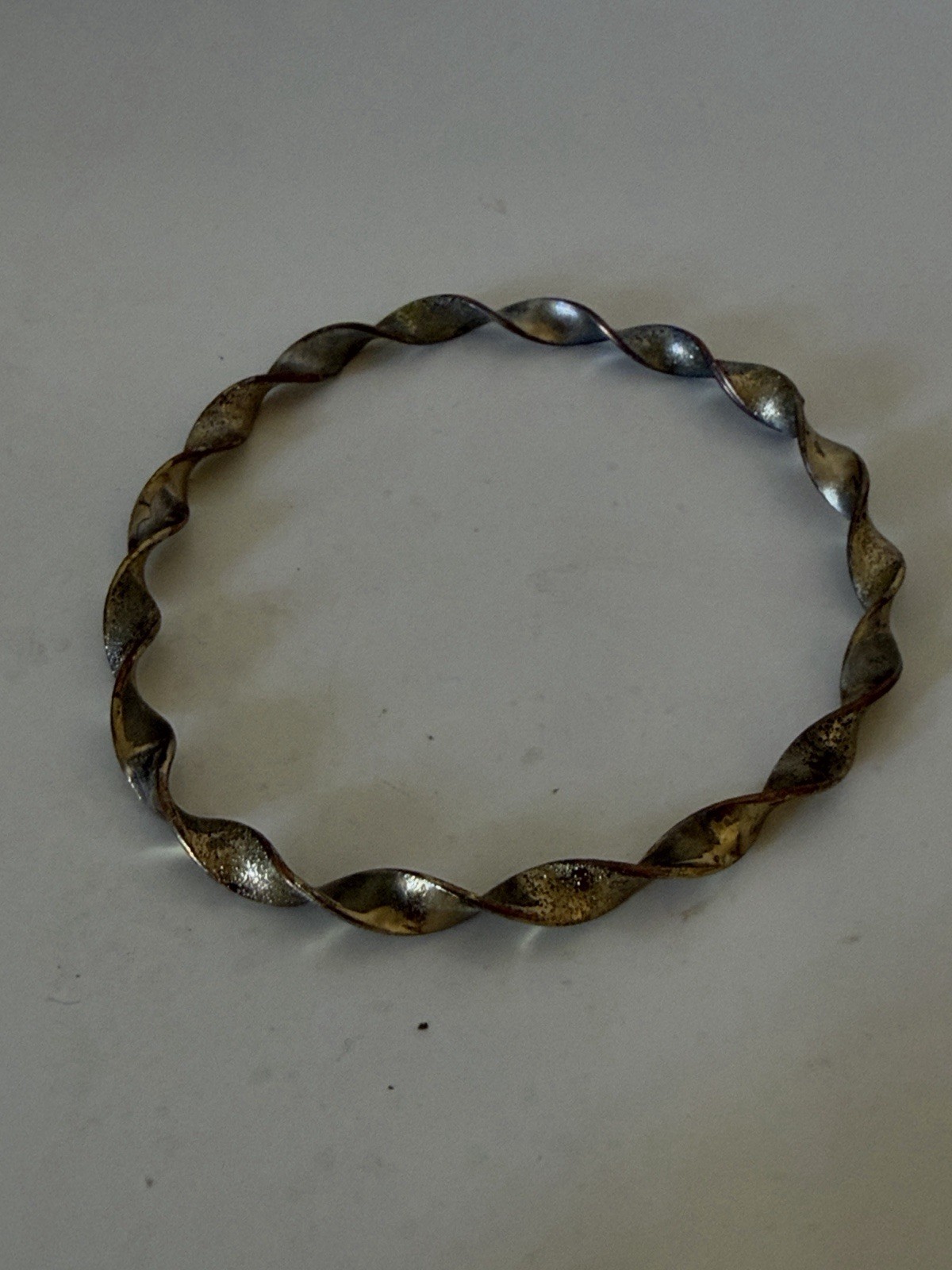 Twisted Metal Bangle Bracelet in Silver Tone