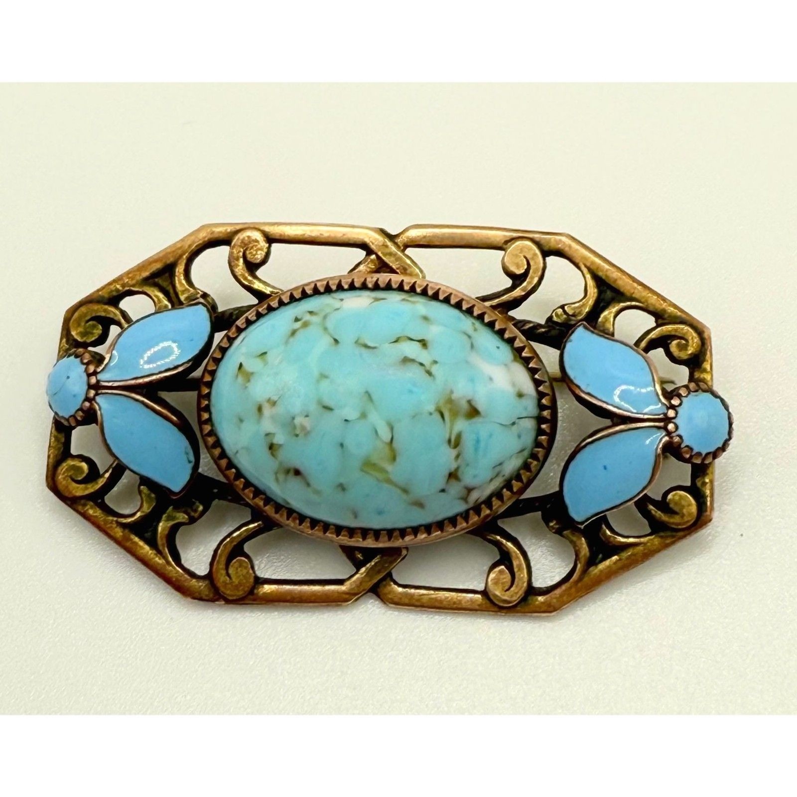 Turquoise brass brooch vintage source unknown