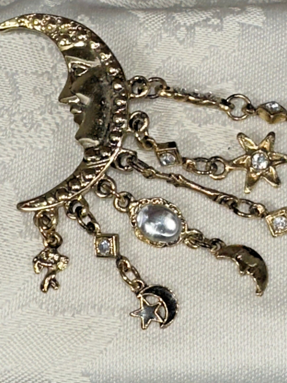 Gold Tone Crescent Moon With Dangling Stars, Cupid, Moon, Rhinestones Brooch