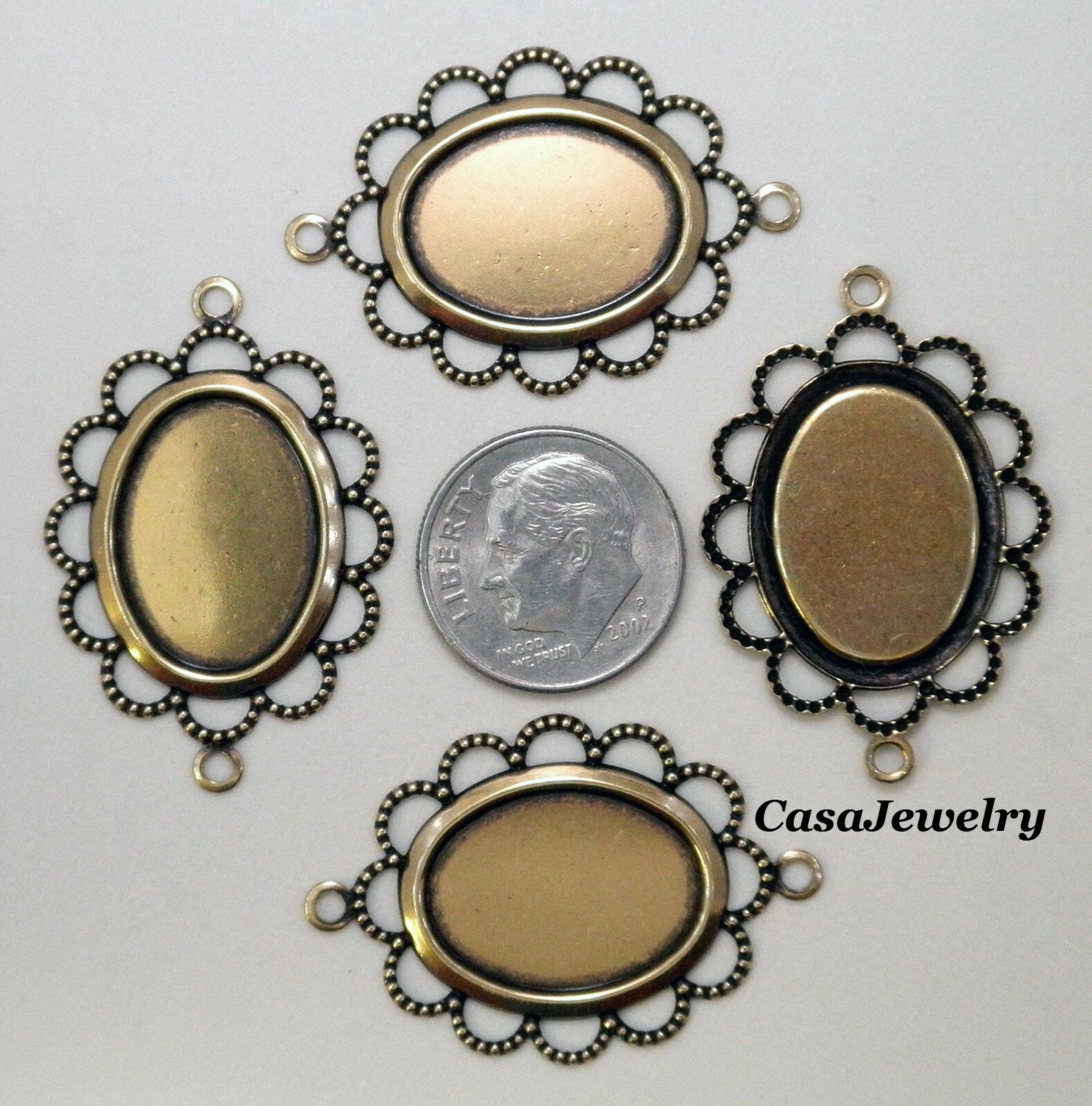 #3056 ANTIQUED GOLD FLAT LACY BORDERED 18×13 BEZEL W/2 HANG RINGS – 6 Pc Lot
