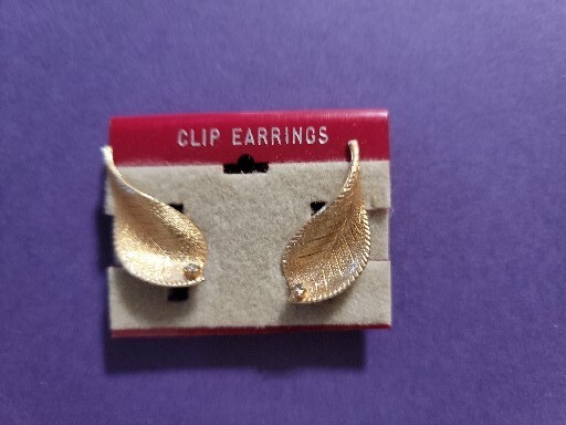 gold toned leaf clip on earrings