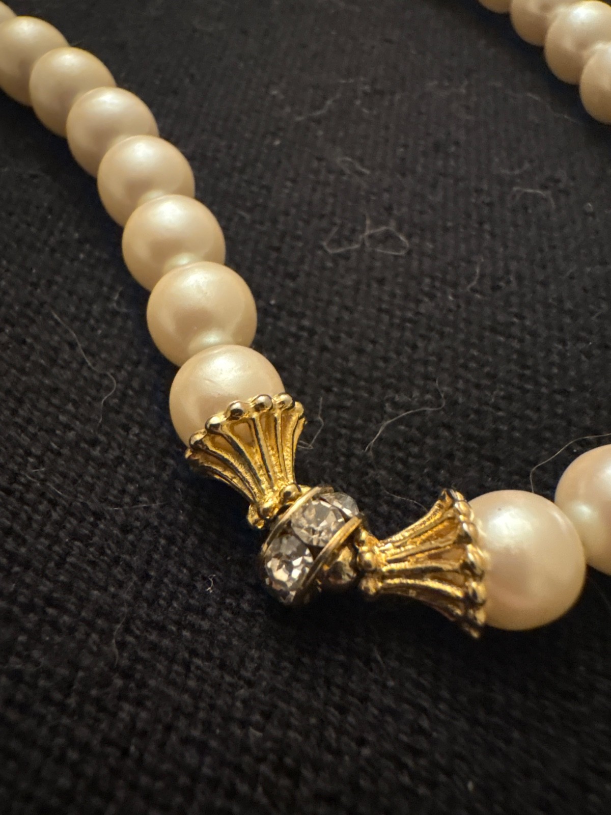 Vintage faux pearl necklace. Locking clasp. 20in. Gold-tone w/ rhinestones