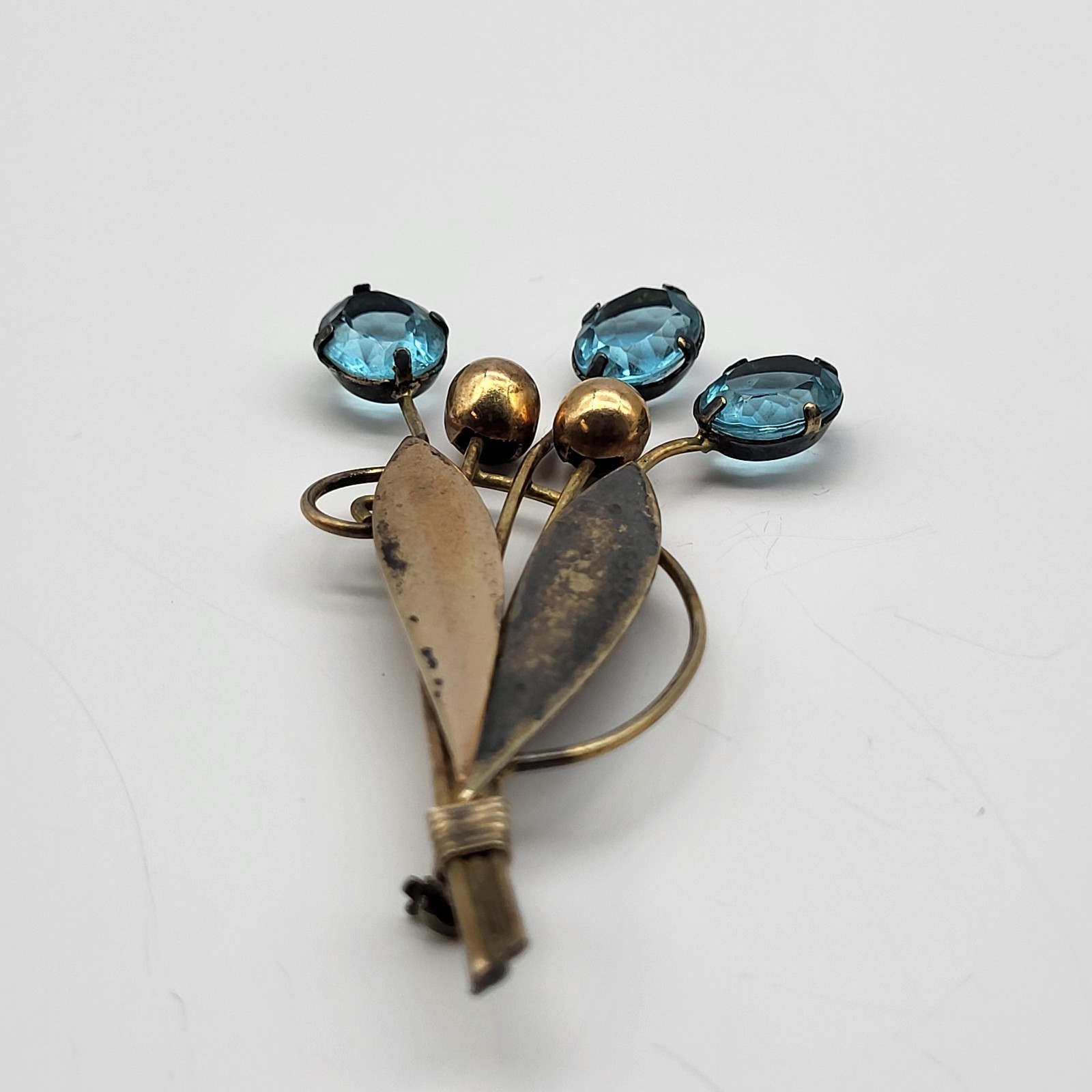 VTG 1/20th 12K gold filled Aqua Blue rhinestone cattail frond brooch pin Patina