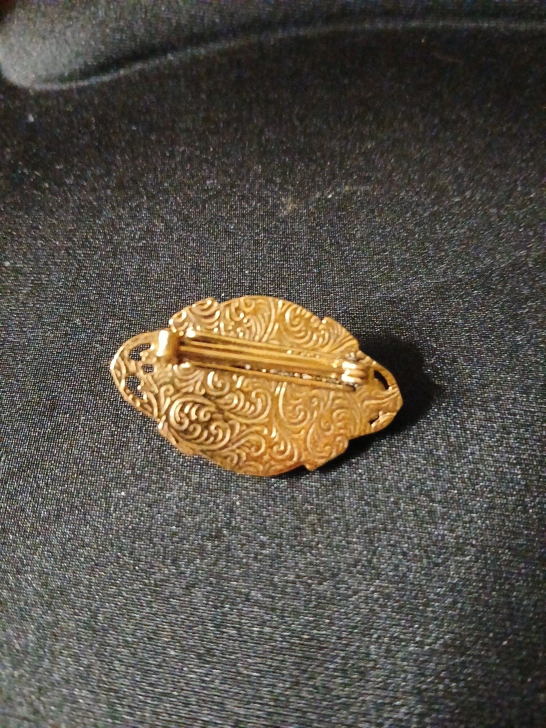 White Cream Colored Lucite Brooch with Red Glass Cabachon in Goldtone Filligree