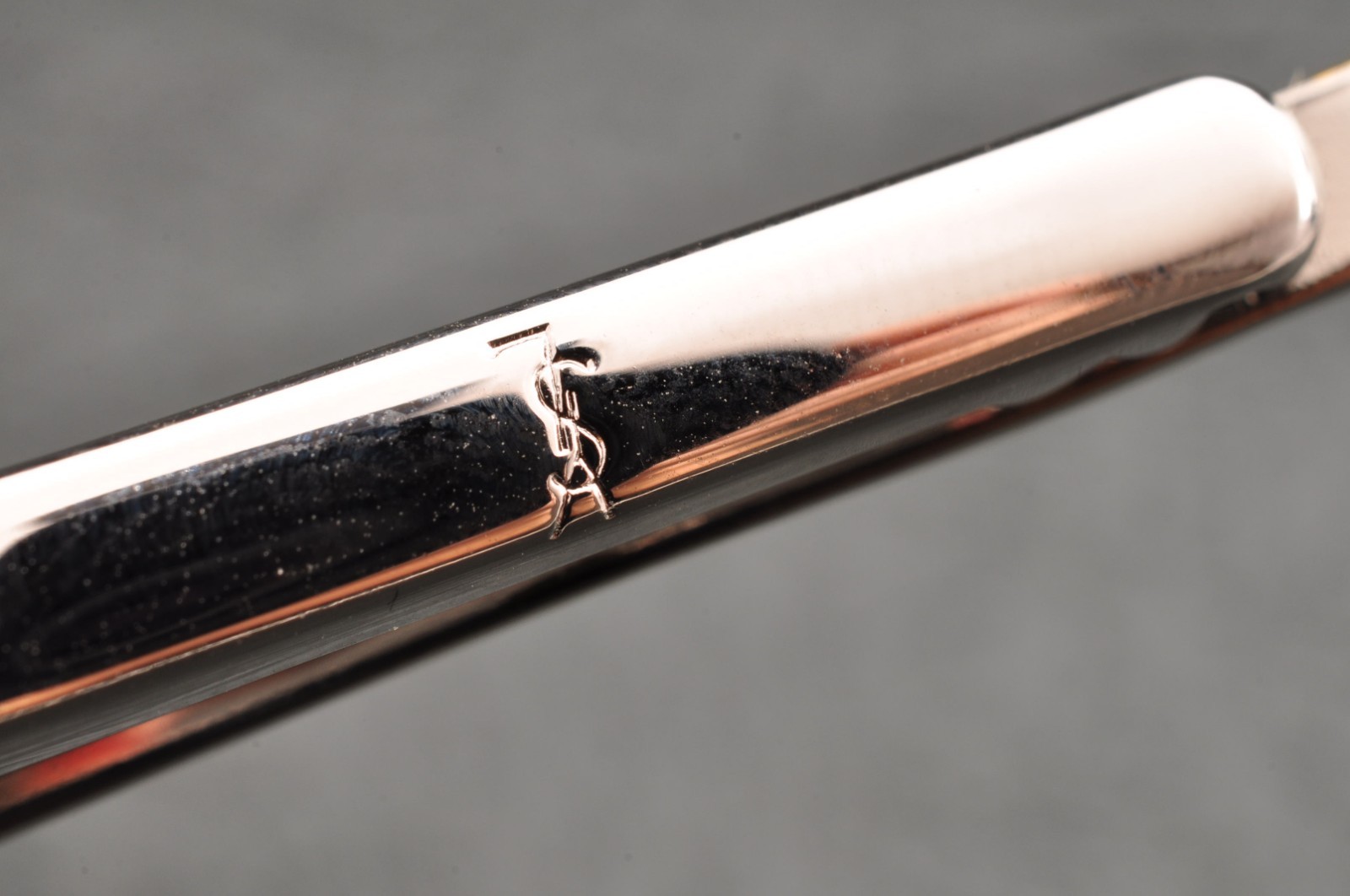 Near mint, gold and Cufflinks and silver tie clip, “Yves Saint Laurent”, case.