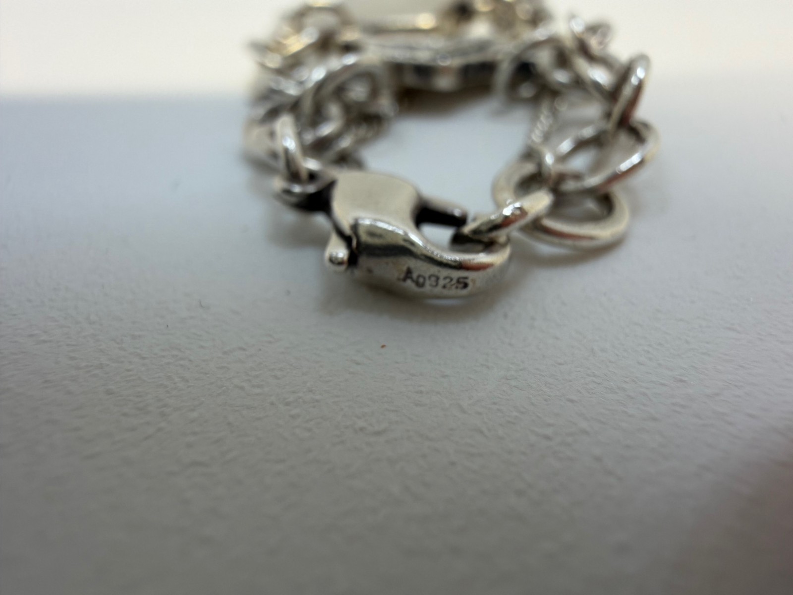James Avery Sterling silver Charm bracelet with 6 Charms 7.5 Inch. 18+ Grams.