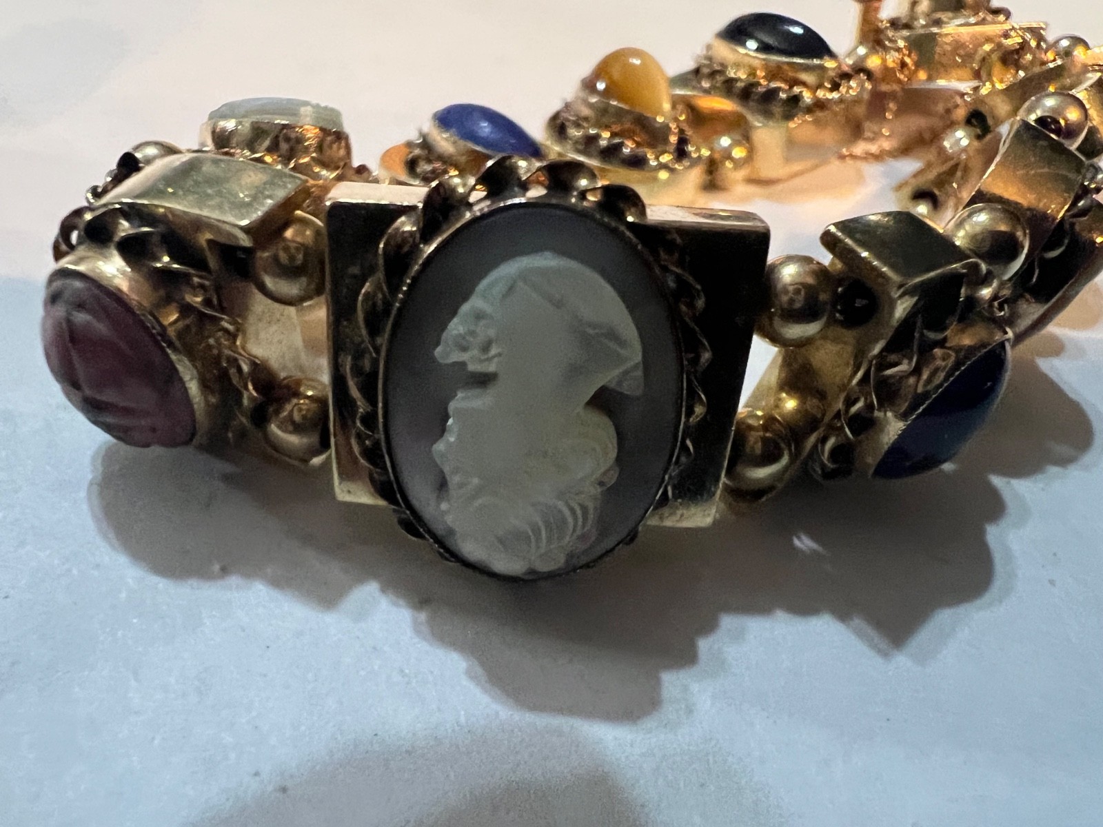 14k Gold ANTIQUE VICTORIAN GOLD CHARMS SLIDE BRACELET. CIRCA (1837-1901)