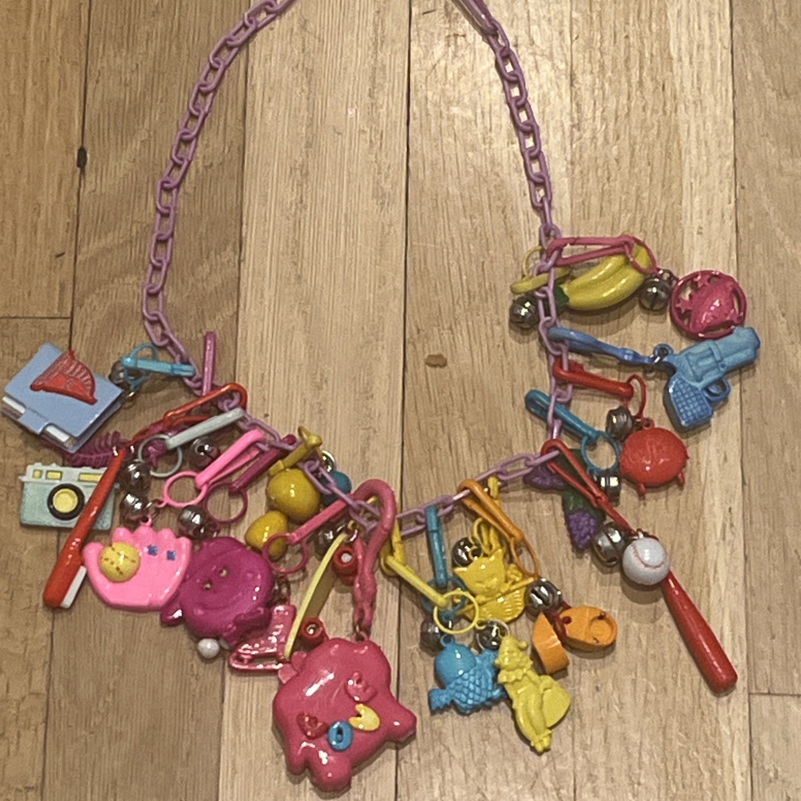 Vintage 1980s Plastic Clip-0n Bell Charm Necklace..20 charms