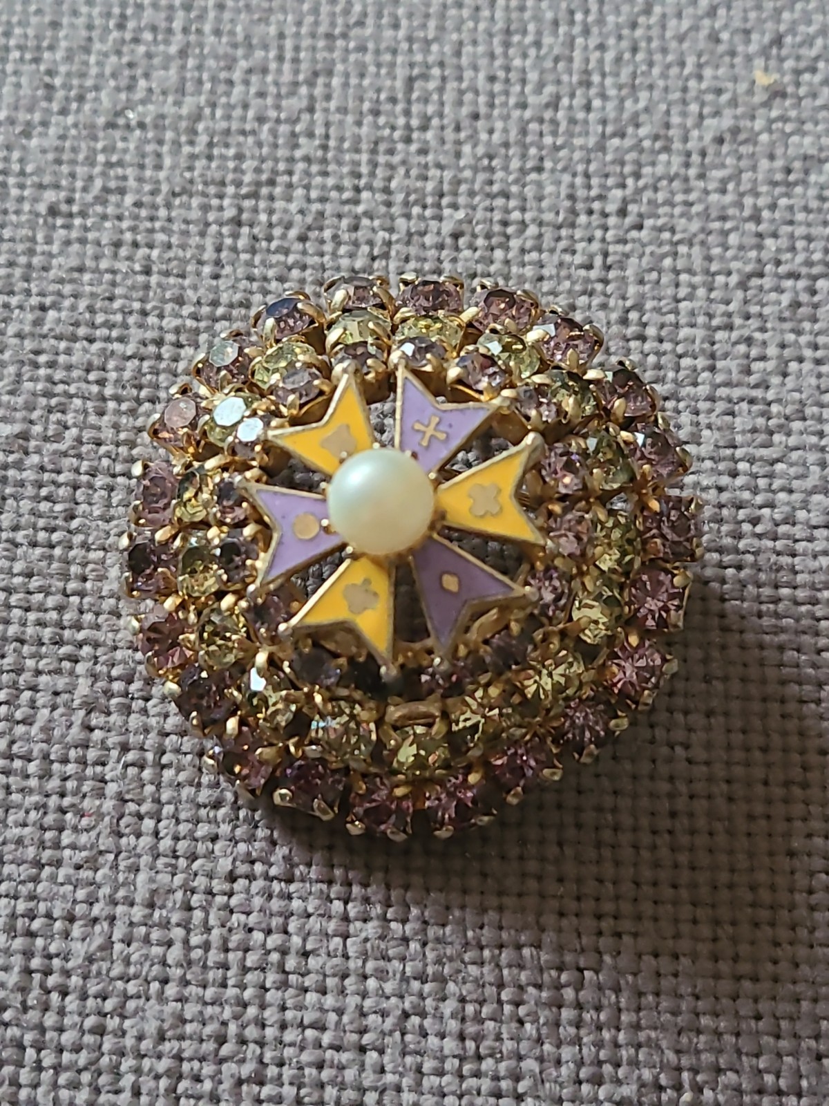 Brooch/pendant in lavender & yellow prong set rhinestones. Dome shape. Vintage