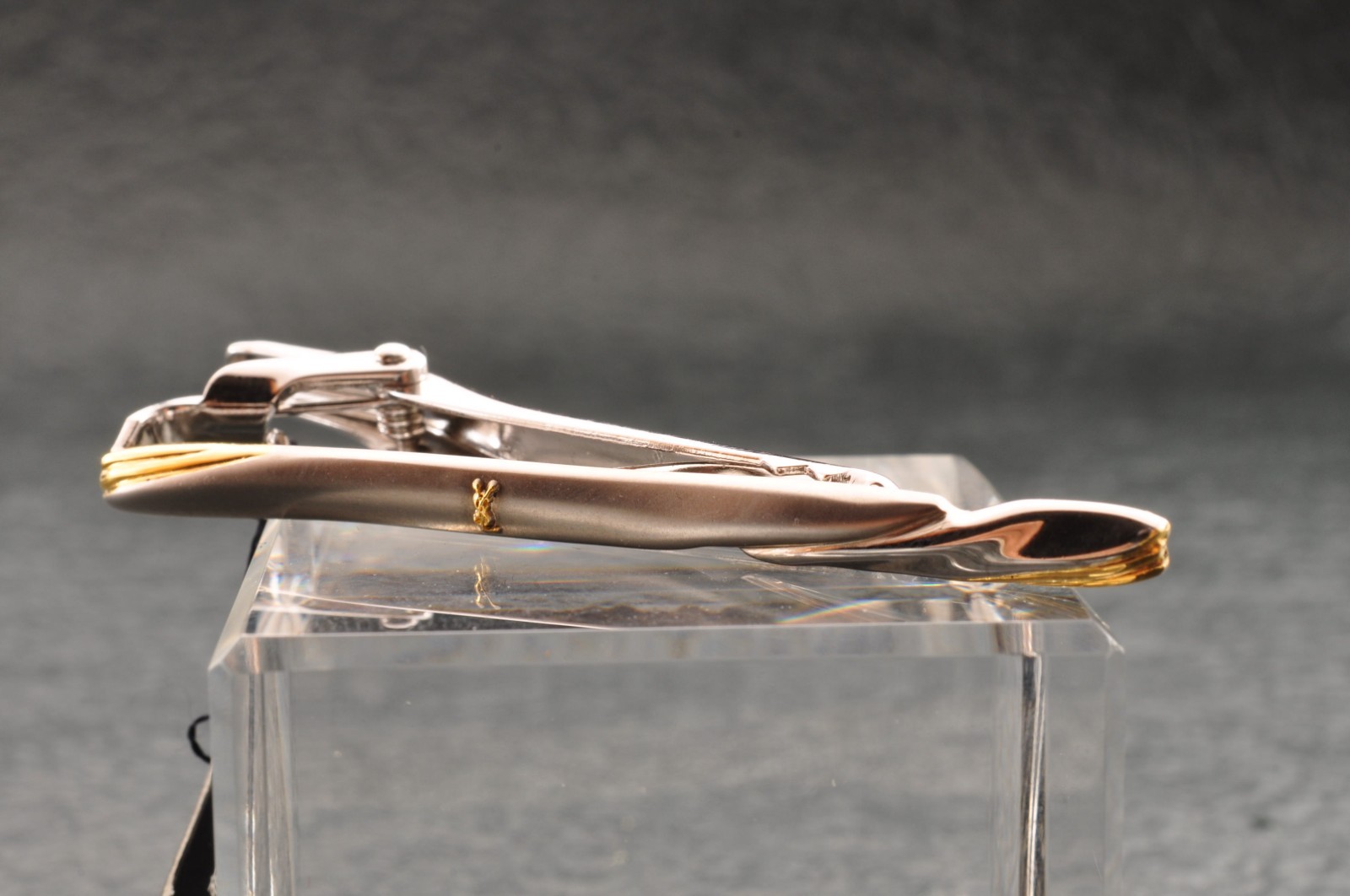 Near mint, gold and Cufflinks and silver tie clip, “Yves Saint Laurent”, case.
