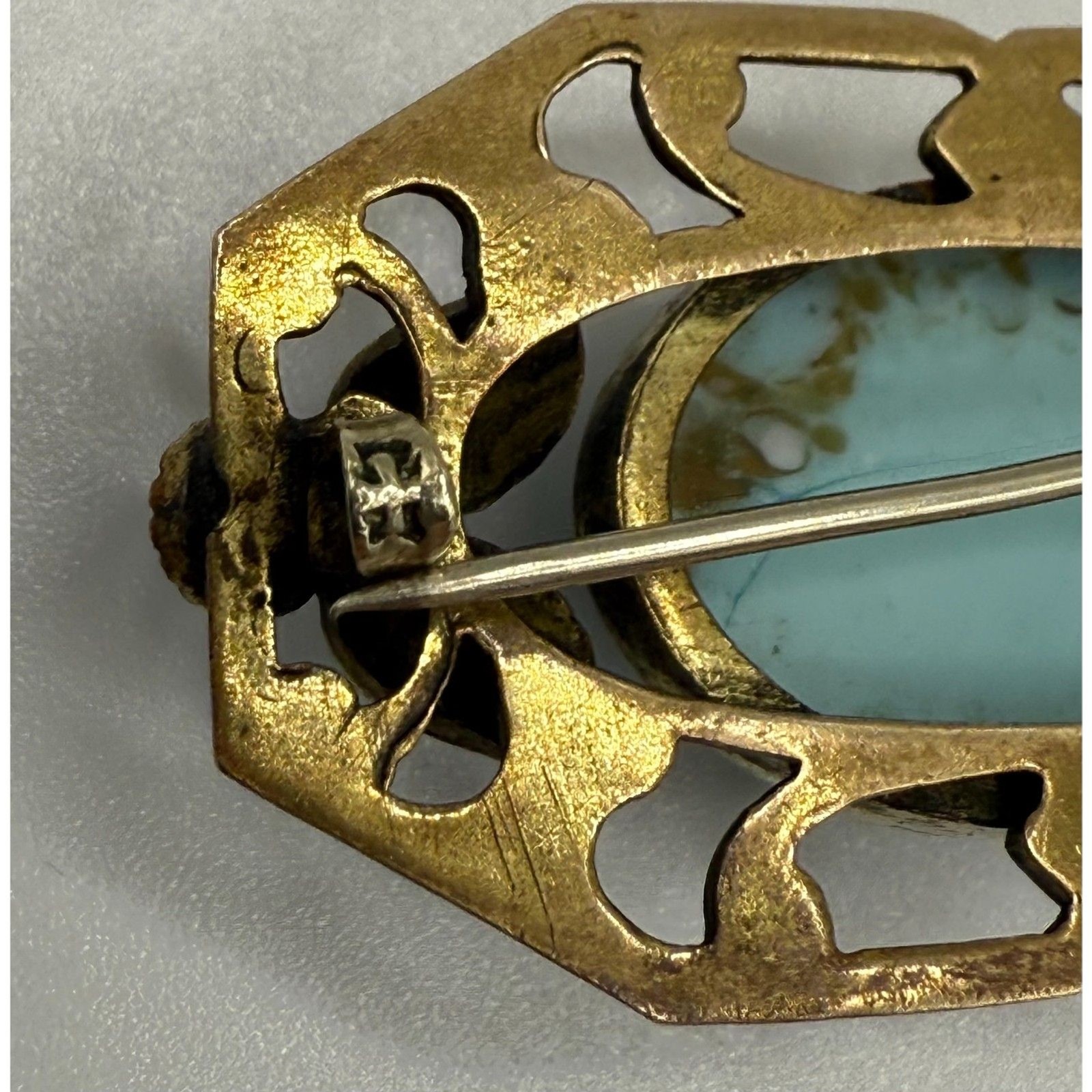 Turquoise brass brooch vintage source unknown