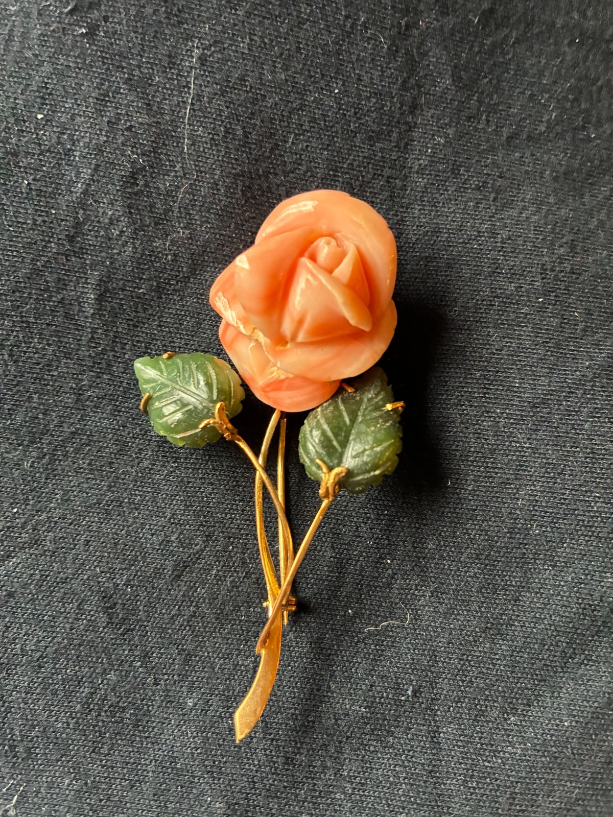 Charming rose-shaped coral pin with enamel leaves