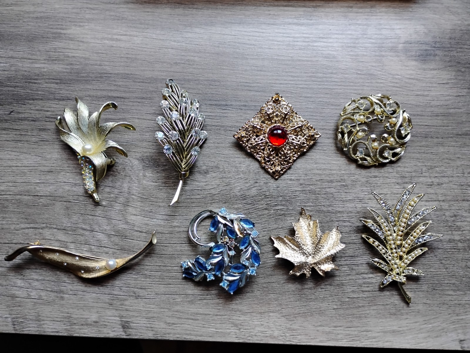 Variety of costume jewelry brooches