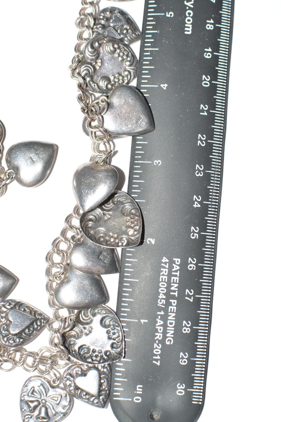 Signed PAJ 925 repousse multiple heart charms necklace 58 grams 24 inches long
