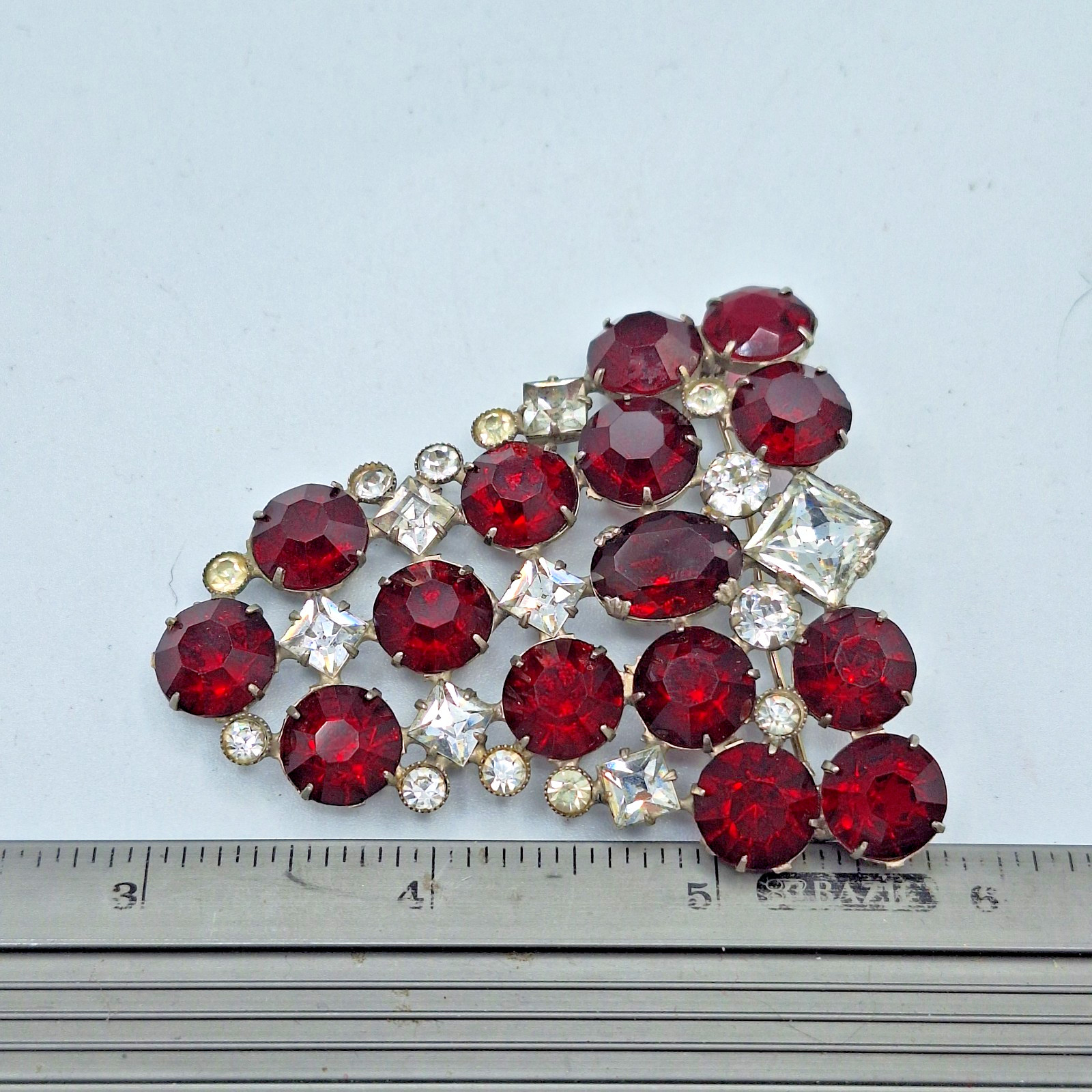 Red and Clear Rhinestone Triangular Brooch Unsigned 2.25″