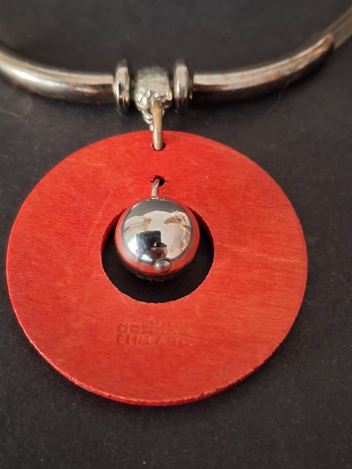 Aarikka Finland necklace with a vibrant red wooden ring pendant