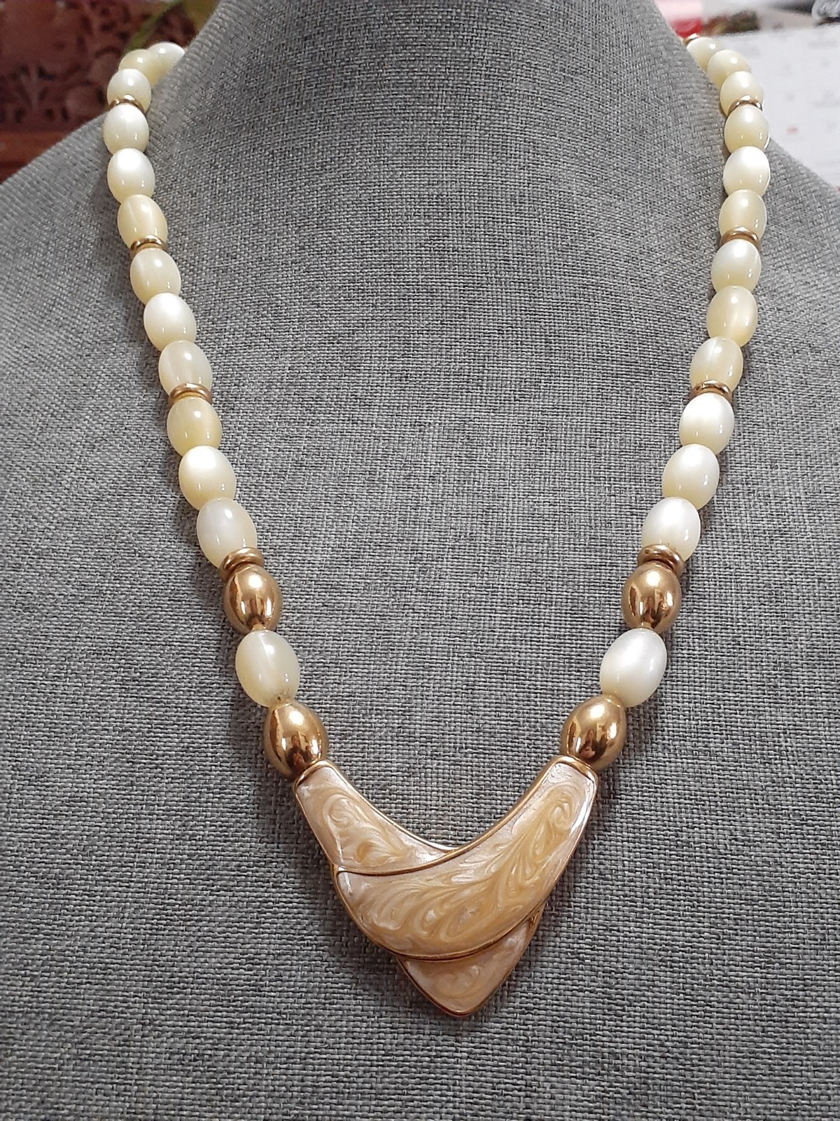 Napier champagne moonglow lucite bead necklace w/Chevron enamel pendant 24″