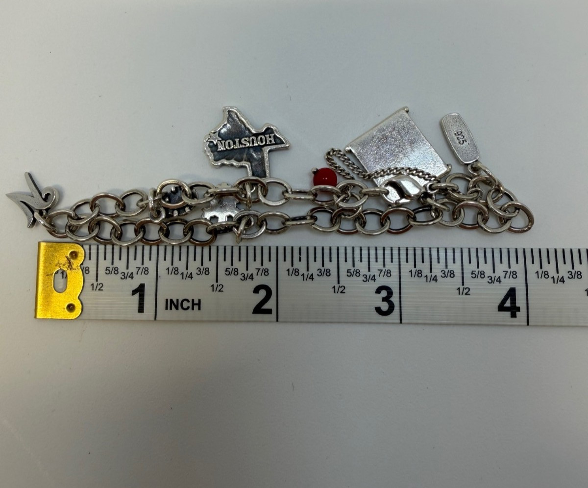 James Avery Sterling silver Charm bracelet with 6 Charms 7.5 Inch. 18+ Grams.