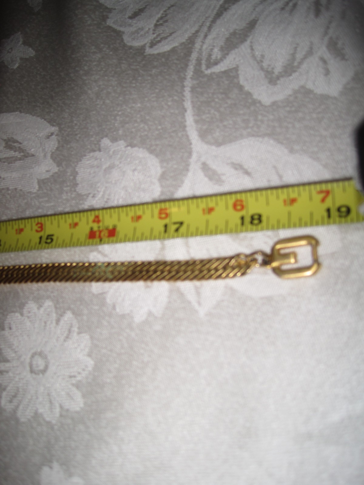signed Givenchy gold tone herringbone flat style chain w/ double G clasp