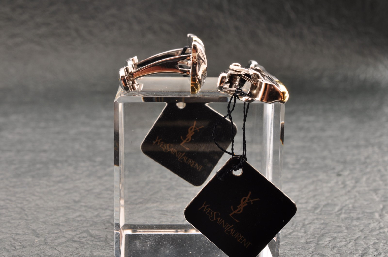 Near mint, gold and Cufflinks and silver tie clip, “Yves Saint Laurent”, case.