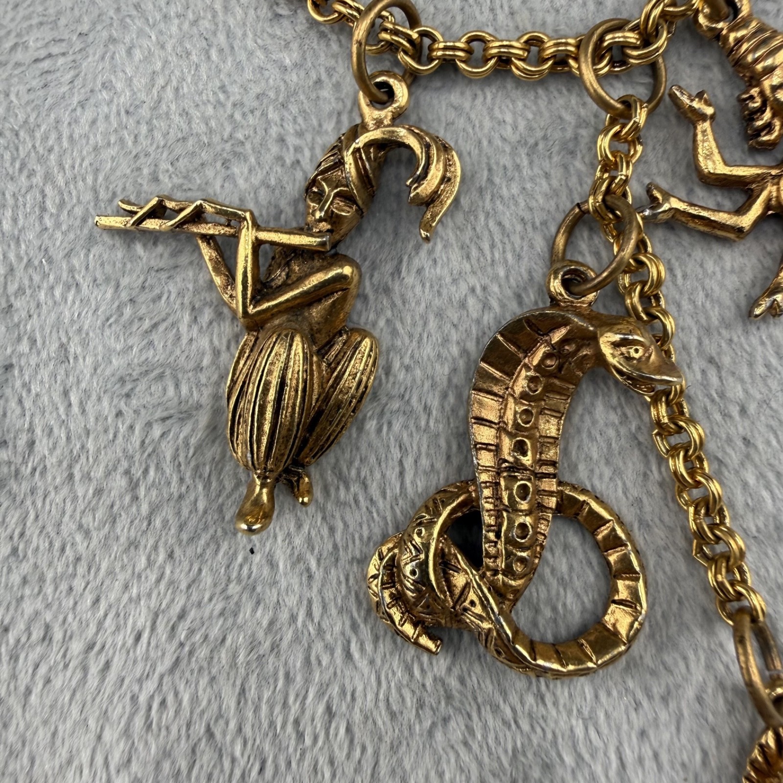 Vintage Asian Charm Necklace Snake Charmer Gold tone 24”