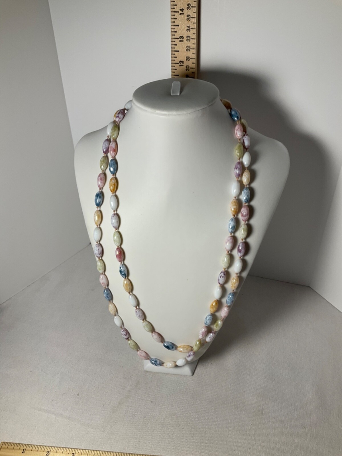 Necklace glass oval shaped beads approximately 50”
